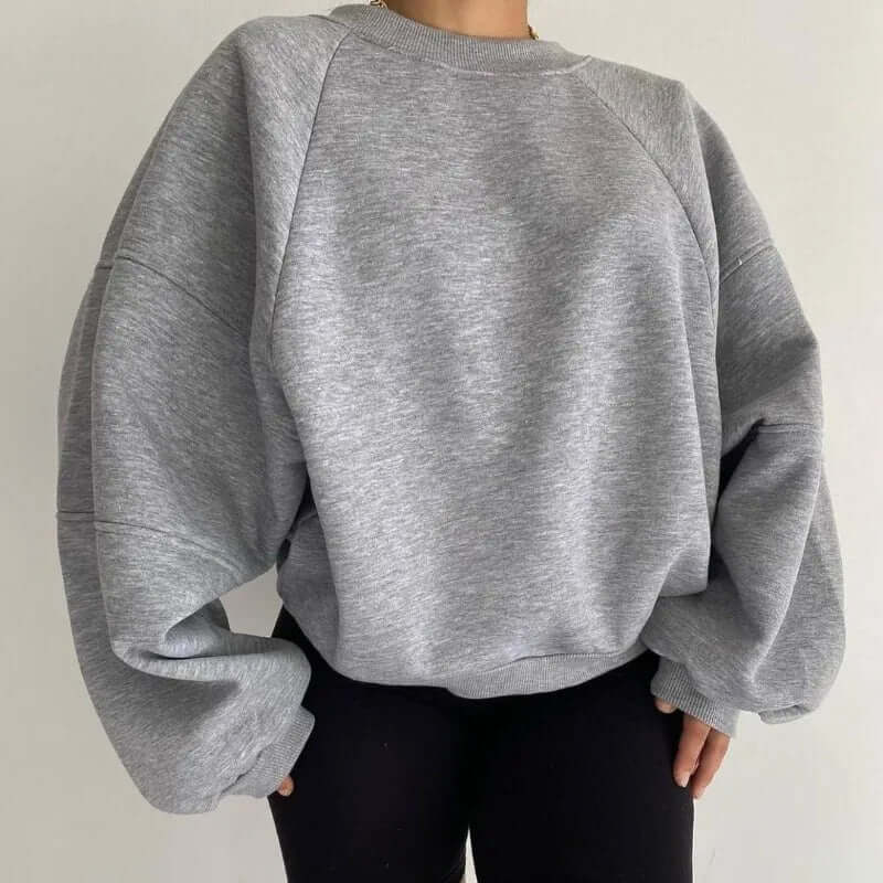 Women's soft fleece sweater in relaxed fit — styled everyday casual look