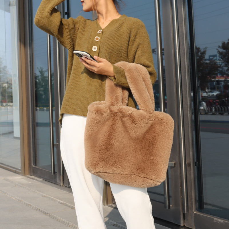 Faux fur tote bag for women showing fluffy exterior texture and structured shape