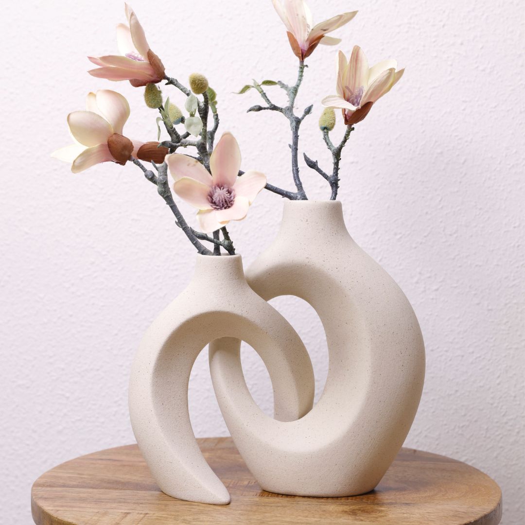 Set of two interlocking ceramic vases with smooth matte surface