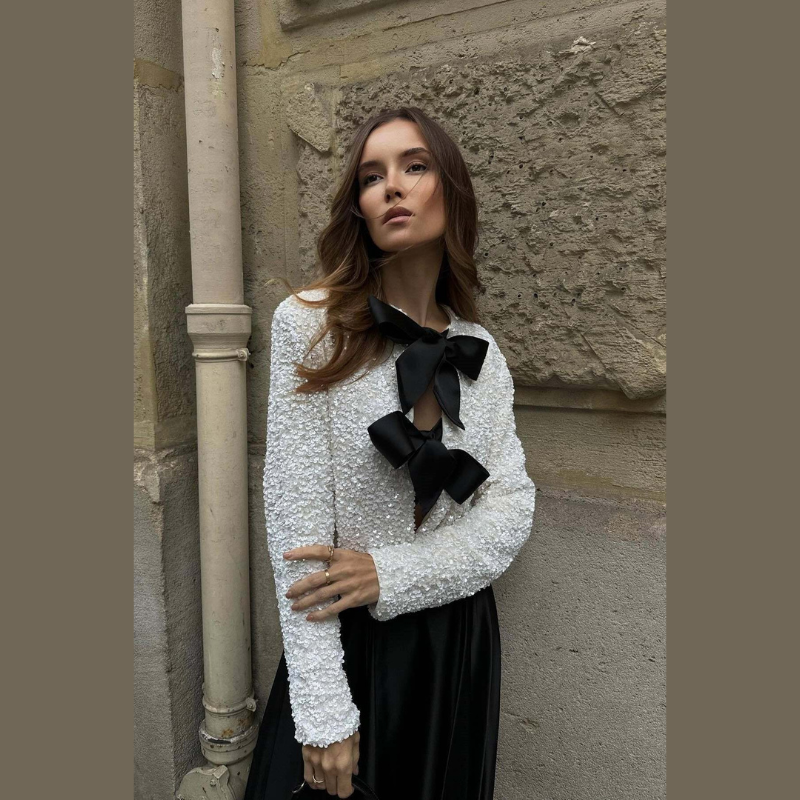 Women's short structured jacket with bow front detail, three-quarter angle view