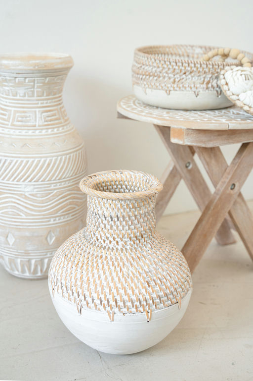 Handmade woven ceramic vase angled side view highlighting craftsmanship