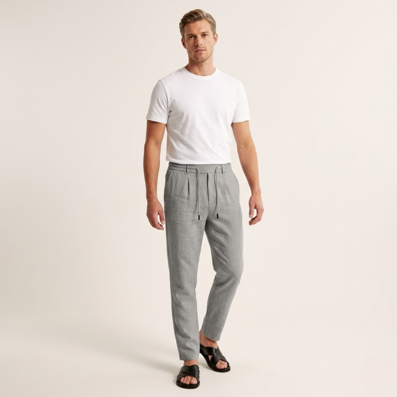 Men's tapered pants with adjustable drawstring and elastic waistband in a muted tone