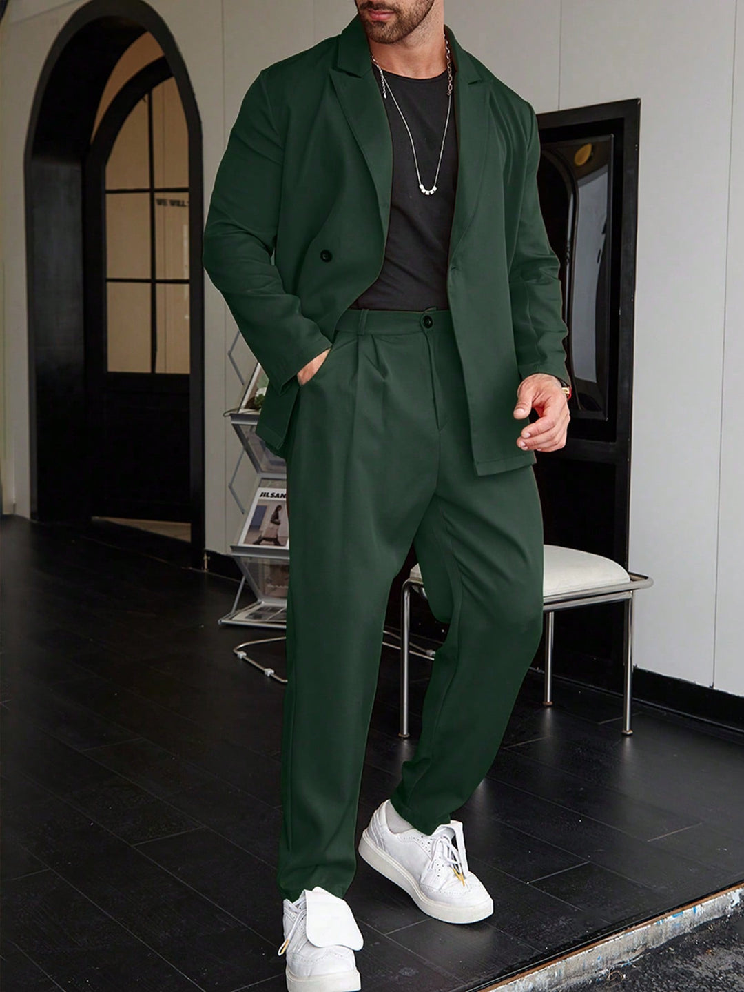 Two-piece men's suit with tailored lapel blazer and full-length straight trousers in woven material