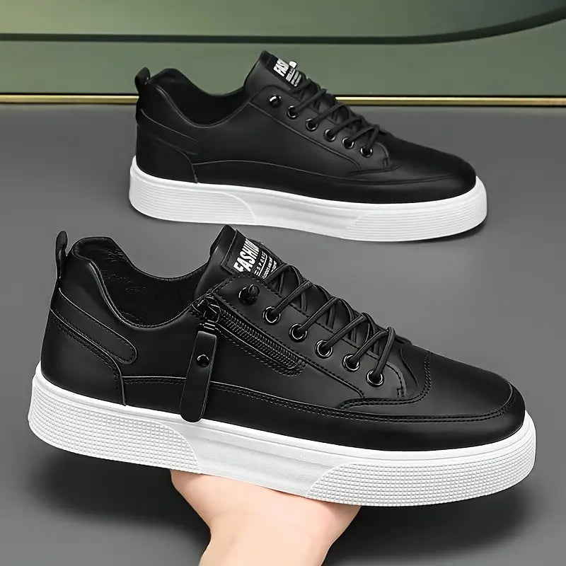 Men's low-top sneakers showing side zipper closure and padded collar detail