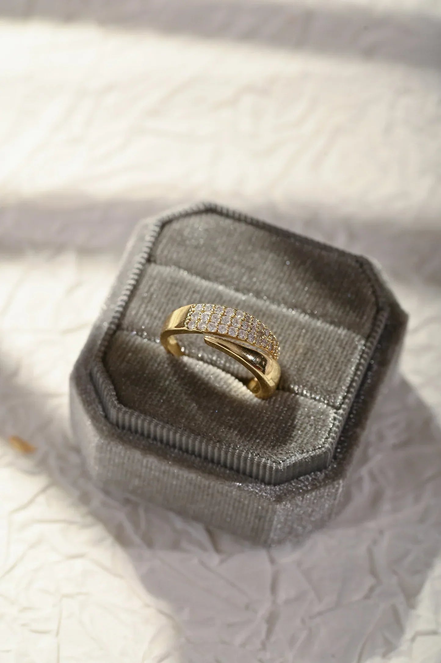 Women's metal ring set with clean band design, worn stacked on finger