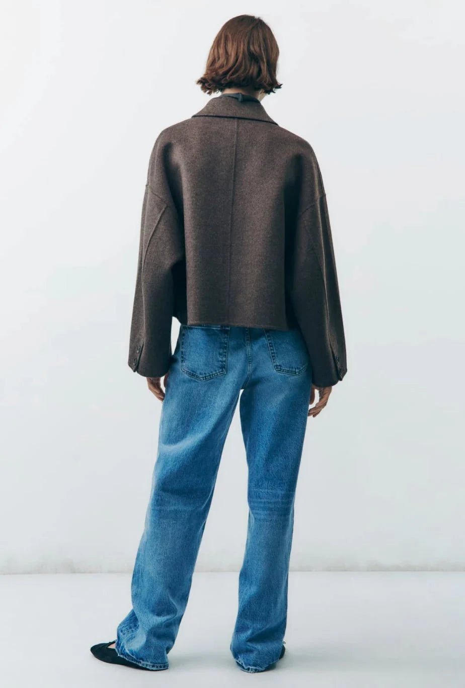 Short wool-blend women's jacket with clean construction and classic collar detail