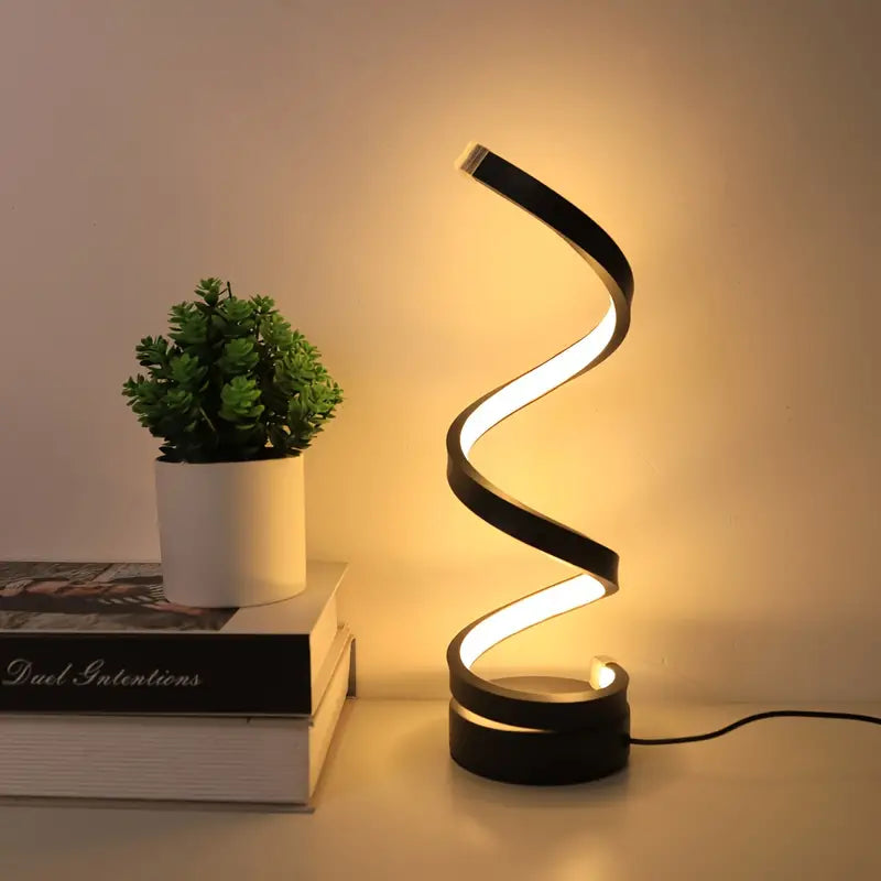 Modern spiral LED table lamp with warm ambient glow on a desk or nightstand