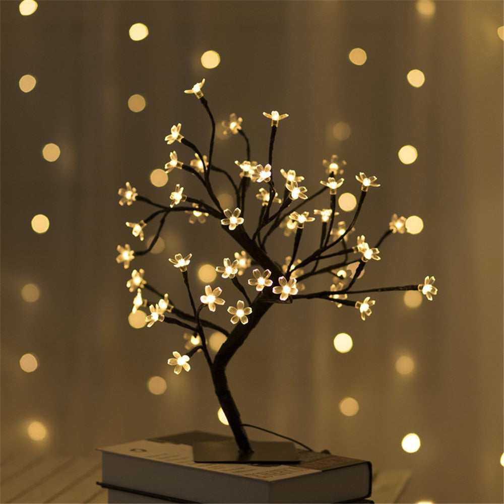 LED Cherry Blossom Decorative Lamp with warm glowing flower lights on a table