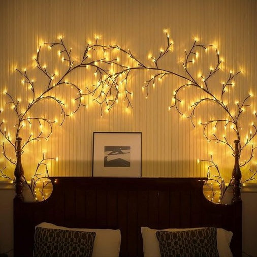 Decorative LED branch string lights shaped and mounted on a wall for ambient home lighting