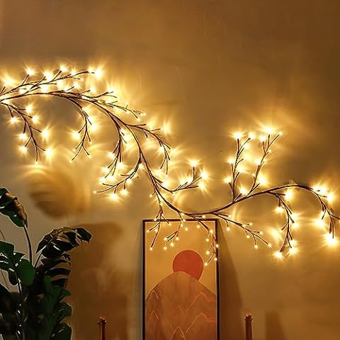 Close-up of flexible wire branches on LED string lights showing warm glow detail