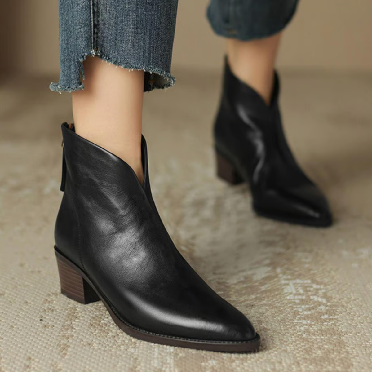 Women's leather ankle boots with block heel, front three-quarter view
