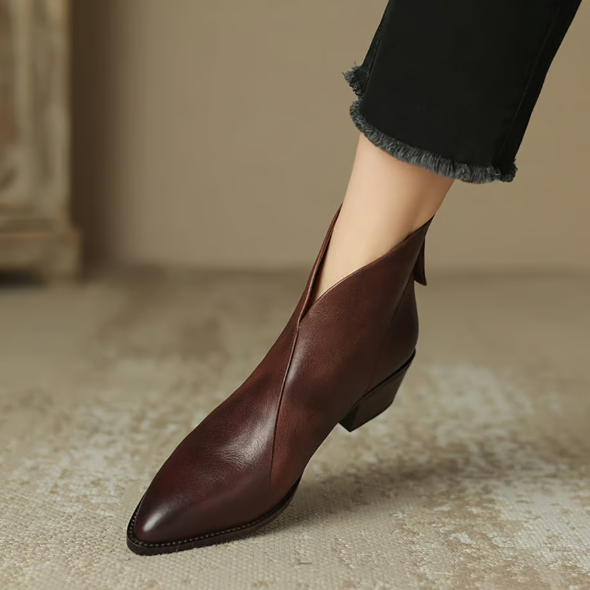 Pointed toe detail on women's leather ankle boots with smooth upper
