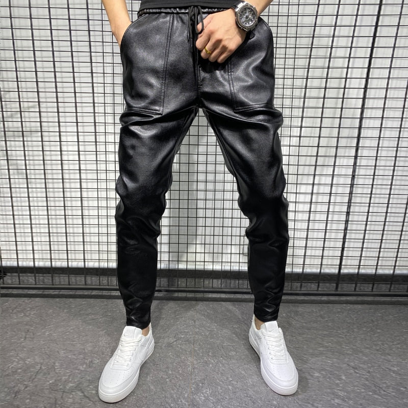 Faux leather men's joggers showing tapered leg silhouette and smooth surface finish
