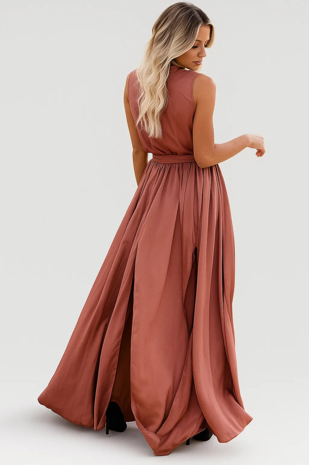 Sleeveless wrap maxi dress with front slit and flowing skirt