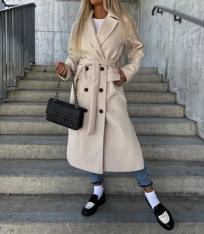 Women's long polyester coat showing full-length tailored fit and clean lines