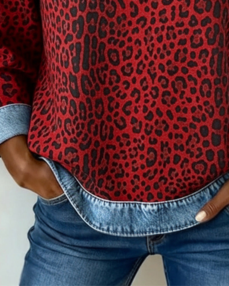 Relaxed-fit leopard print top with denim hem trim and clean panel seams