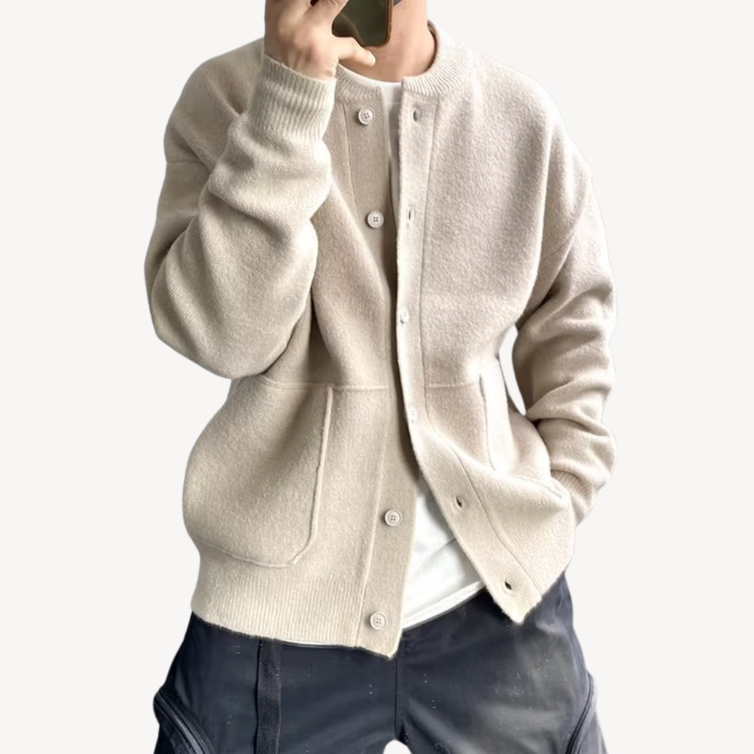 Close-up of button closure and knit texture on men's relaxed-fit cardigan