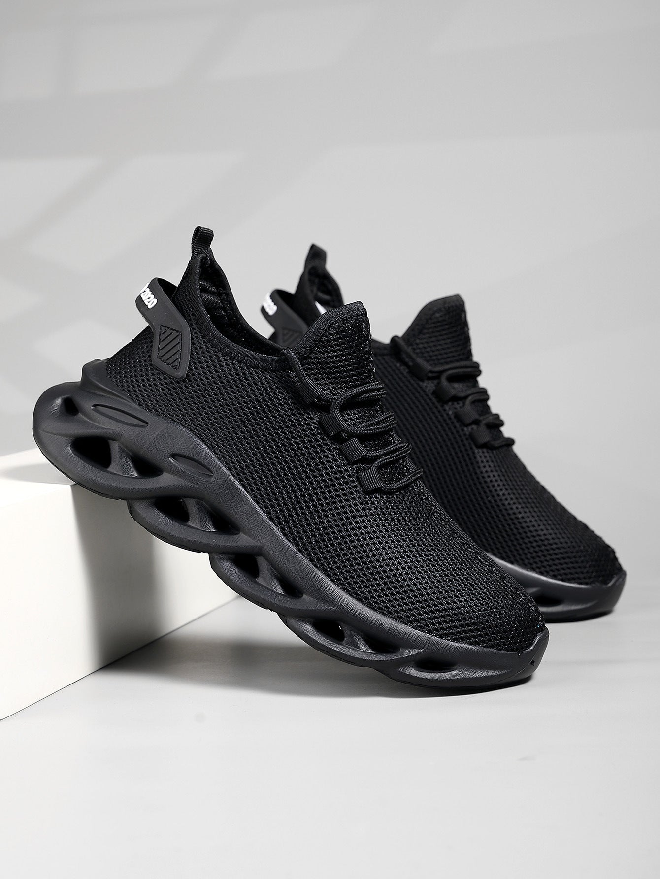 Men's mesh sneaker with round toe and low-profile sole, lateral side view