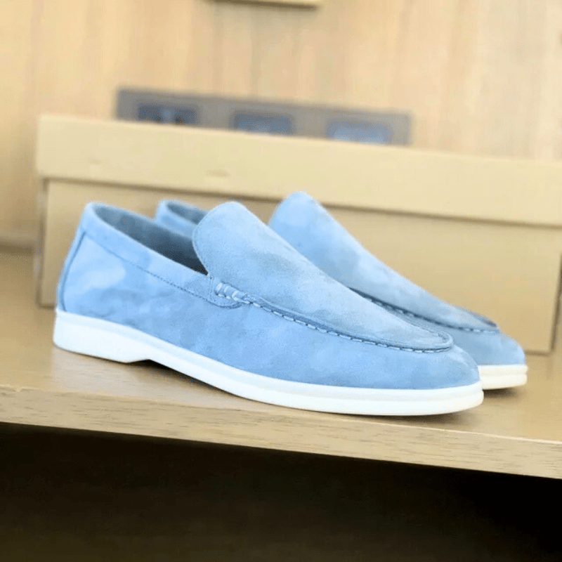 Close-up detail of men's suede loafer upper showing material texture and stitching