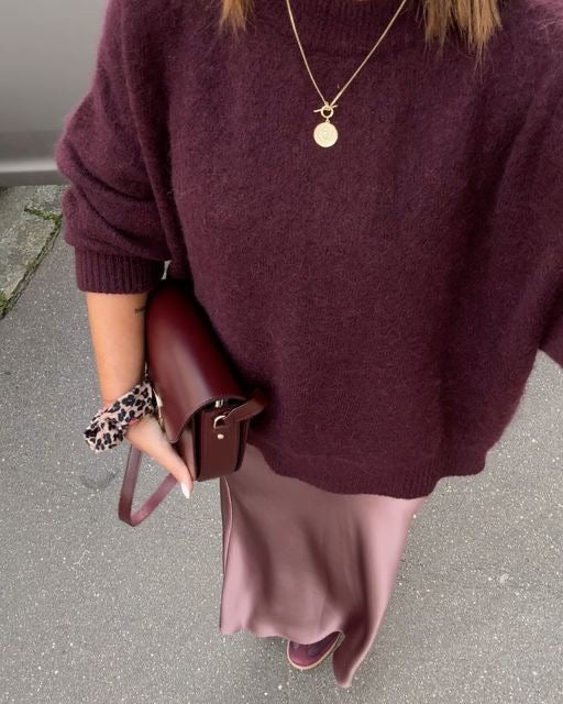 Front view of women's fuzzy knitted sweater in relaxed pullover silhouette