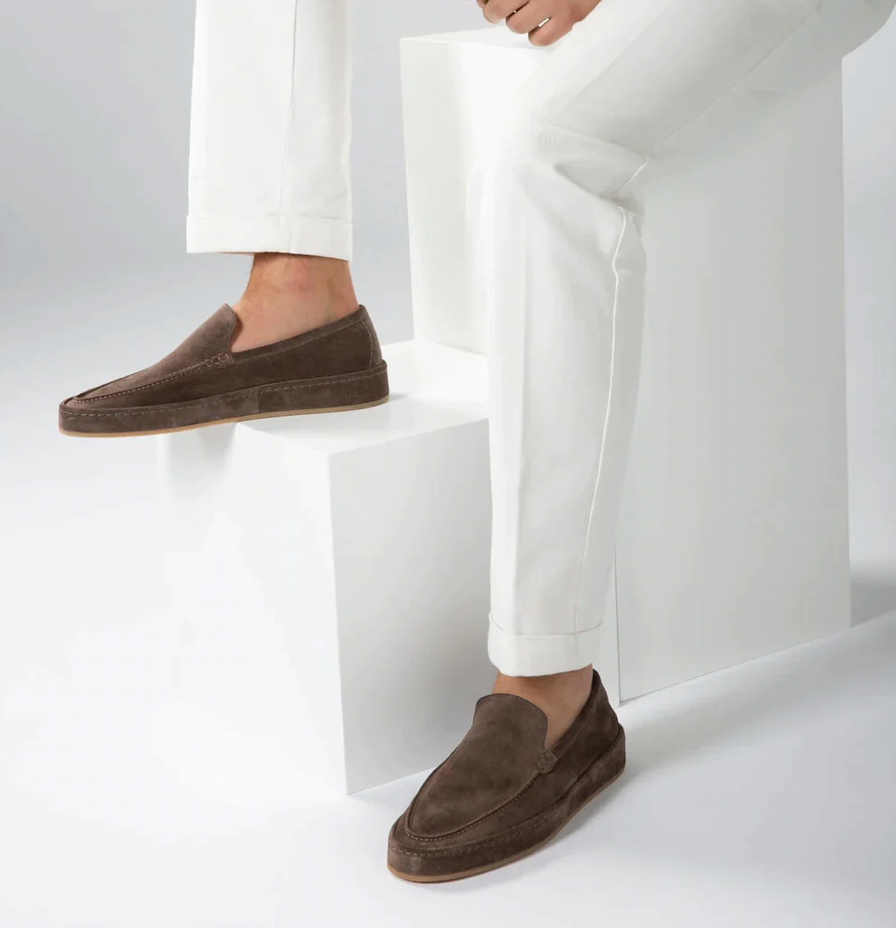 Men's suede loafers in light blue, structured silhouette front view