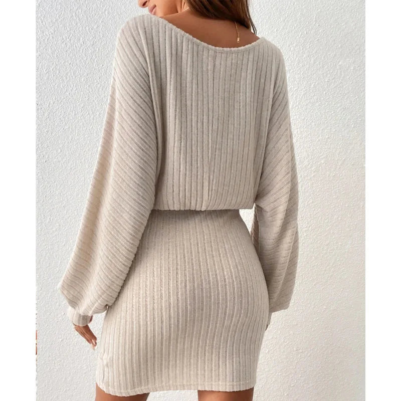 Form-fitting ribbed knit dress with long sleeves and straight hem