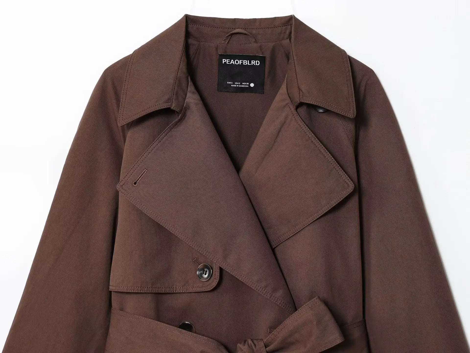 Women's hip-length wrap jacket with long sleeves and panel construction