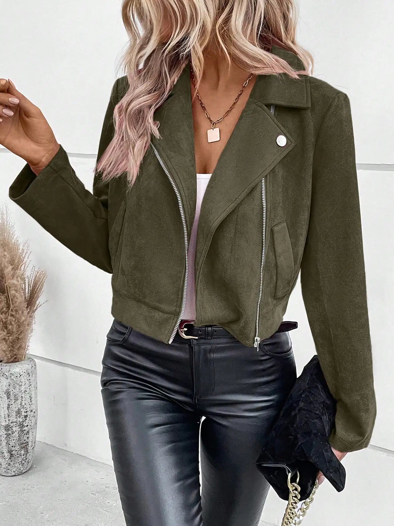 Short women's biker jacket with asymmetric zipper and metal details