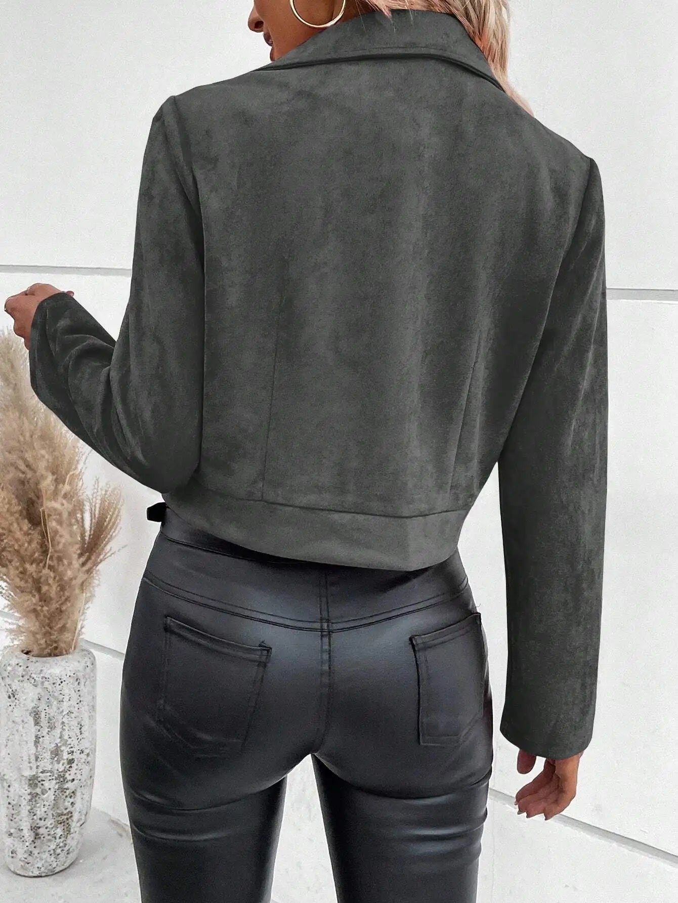 Short women's biker jacket with lapel collar and metal hardware