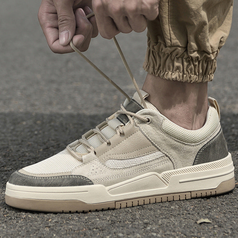 Men's retro sneakers showing lace-up closure and layered mesh construction, side profile view
