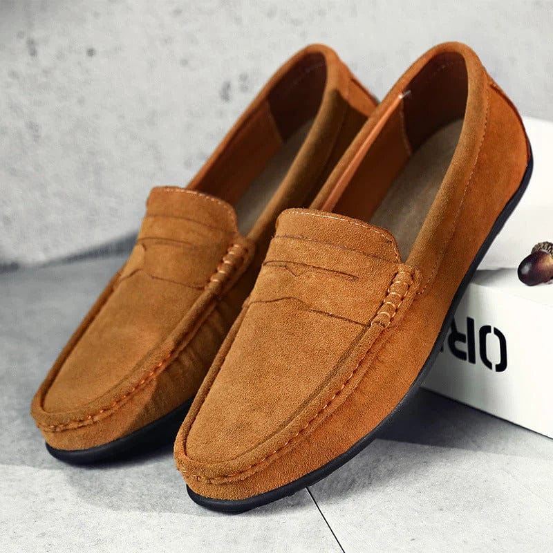Men's slip-on suede loafers styled in a casual everyday setting