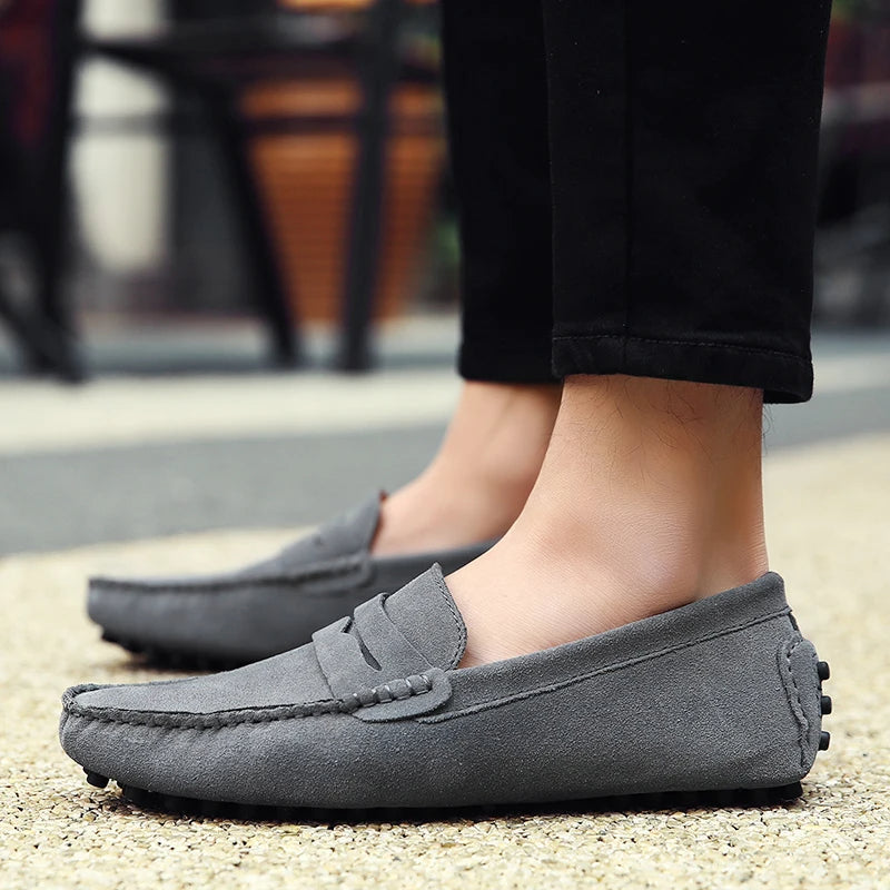 Black slip-on suede loafers for men with classic front stitching detail