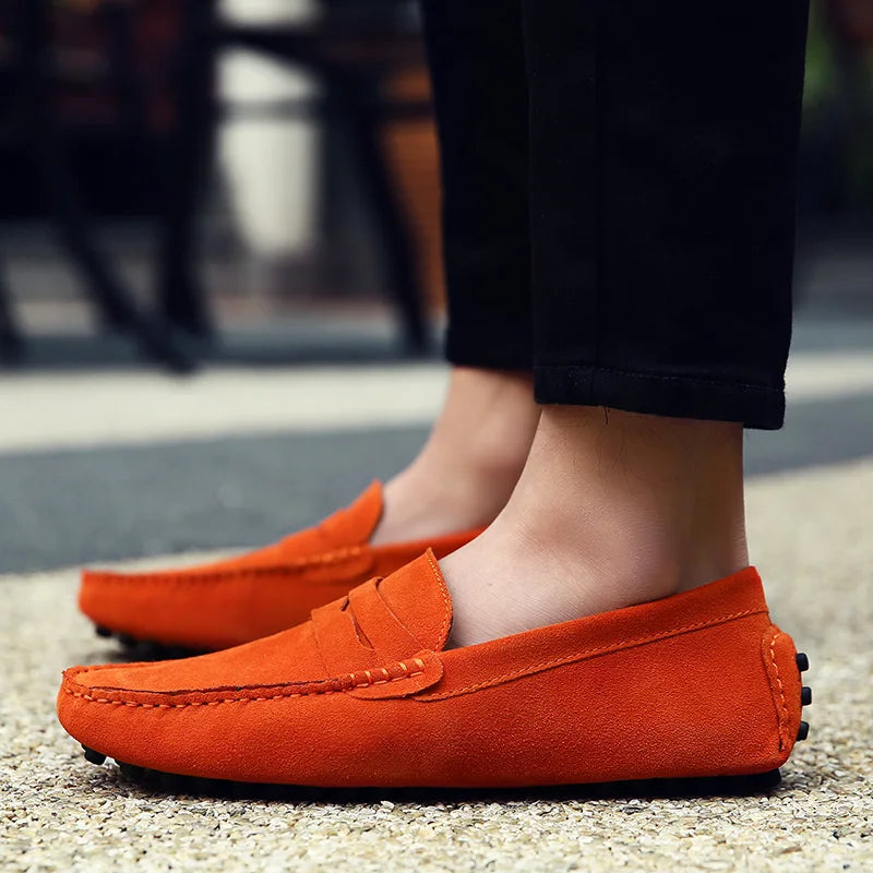 Men's suede loafers side profile showing low-cut collar and rubber sole