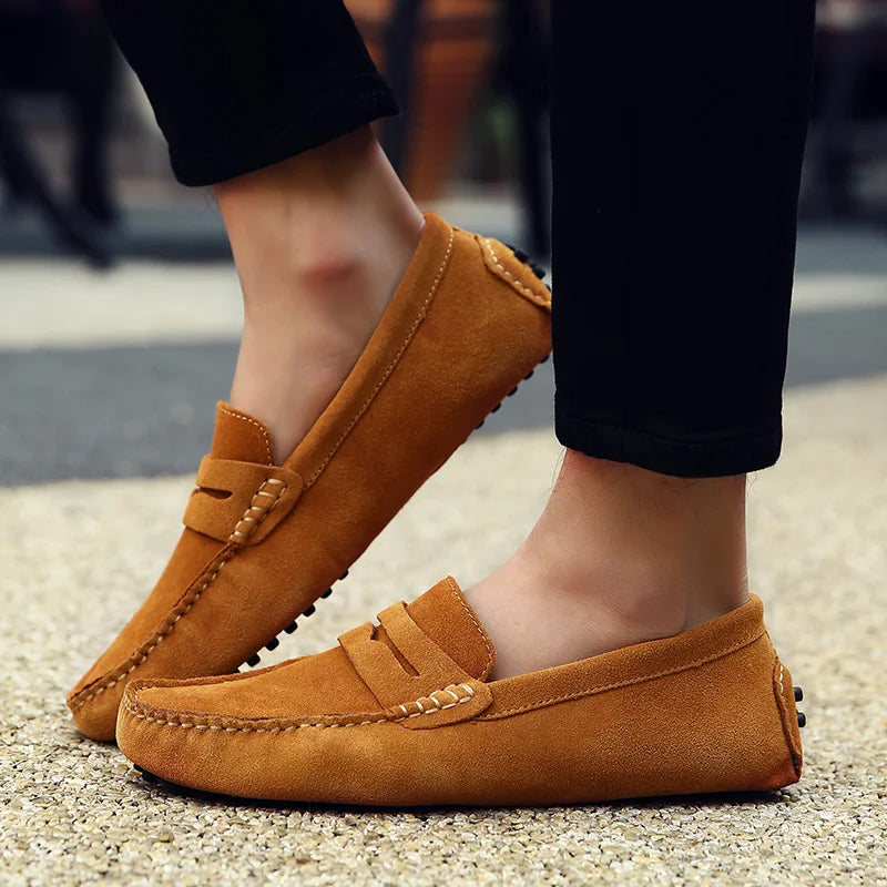 Rear view of men's black suede slip-on loafers with non-slip rubber sole
