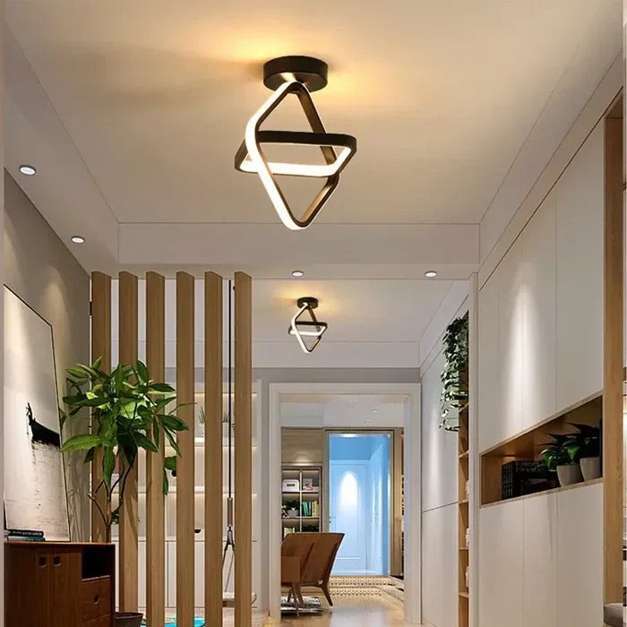Round white modern LED ceiling light flush-mounted on a white ceiling