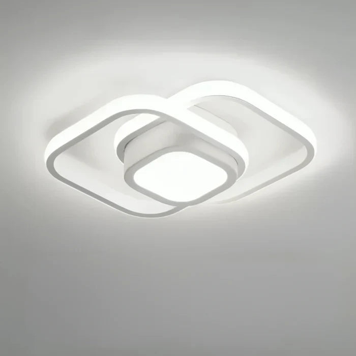 Modern LED ceiling light double ring design showing warm light spread in a room