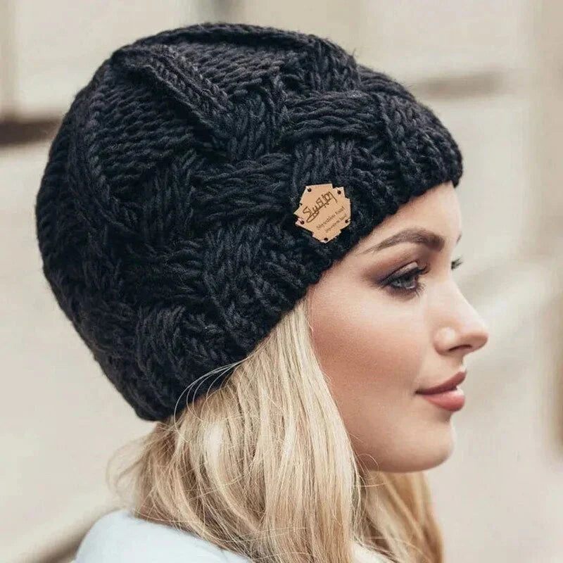 Women's chunky knit winter hat with textured ribbed pattern and relaxed fit
