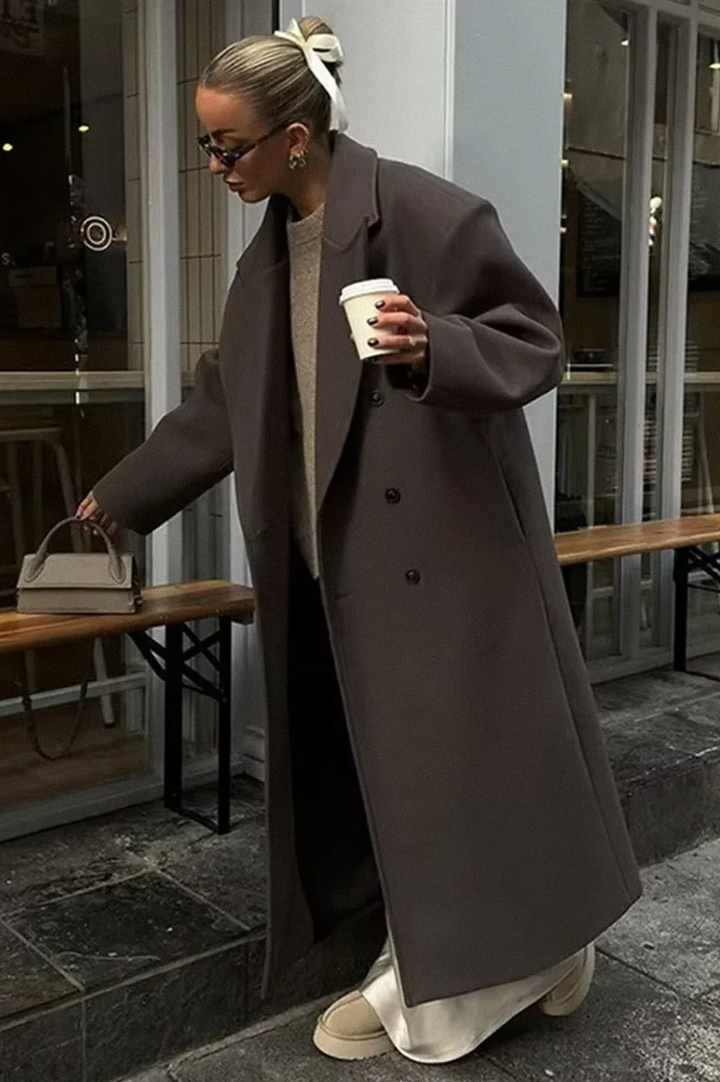 Women's long double-breasted wool blend coat, back view showing structured silhouette