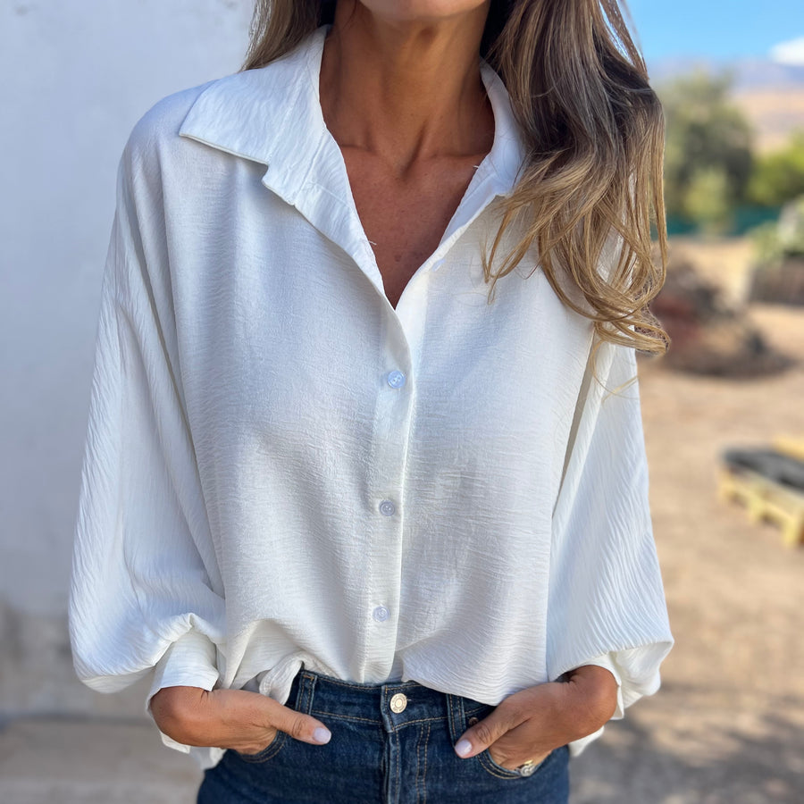 Women's relaxed button-up blouse with 3/4 sleeves and a soft shirt collar
