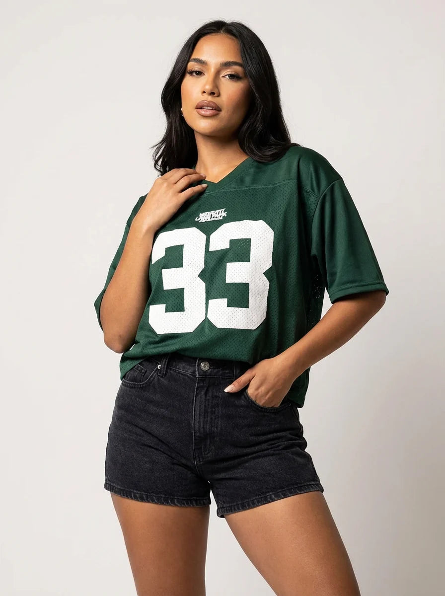 Green oversized jersey number T-shirt women styled with shorts