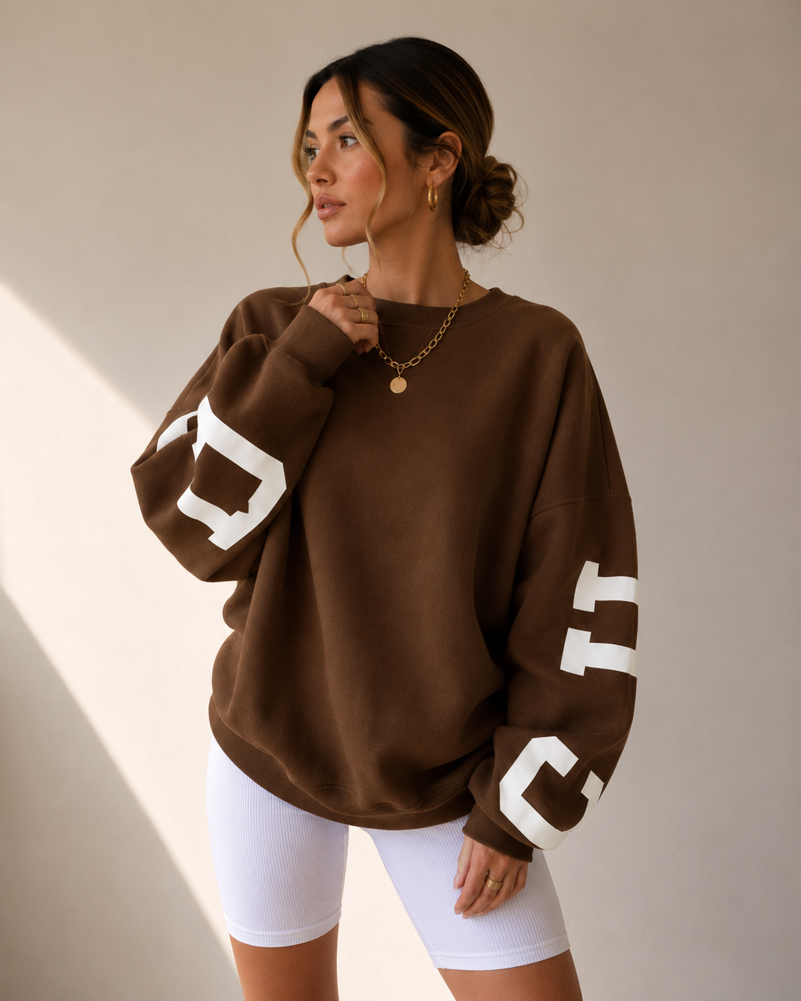 Women's brown oversized varsity sweater front view