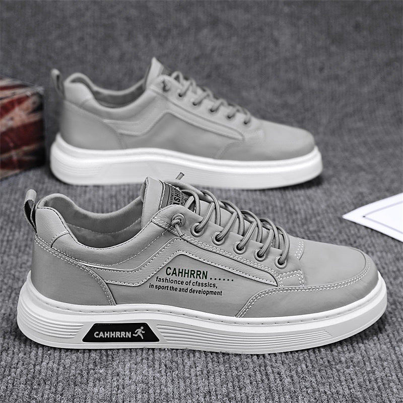 Men's casual synthetic leather sneakers featuring a lace-up closure, round toe, and flat rubber outsole