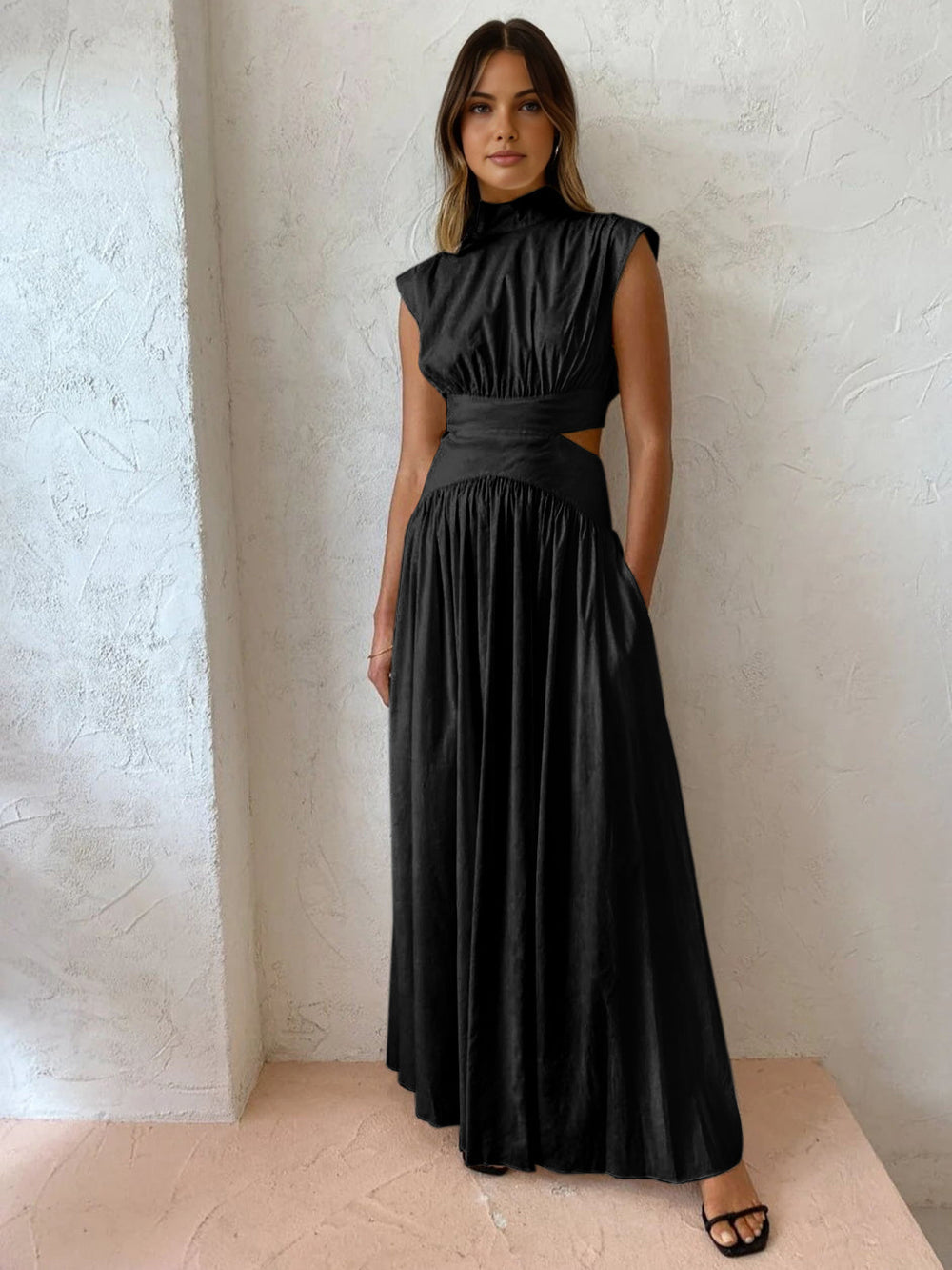 Full-length women's dress with fitted bodice, cut-out waist detail, and high neckline