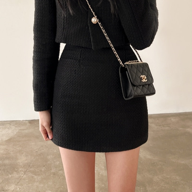 Structured woven two-piece set with long-sleeve cropped jacket and high-waisted mini skirt for women