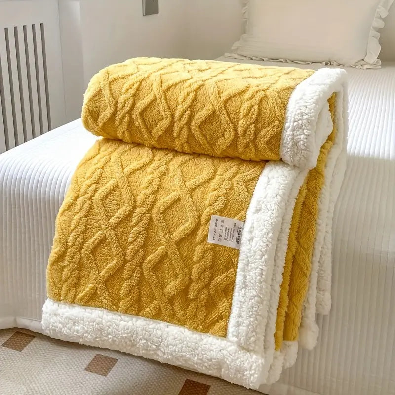 Corner detail of plush blanket with sherpa lining, highlighting edge finish and fabric depth