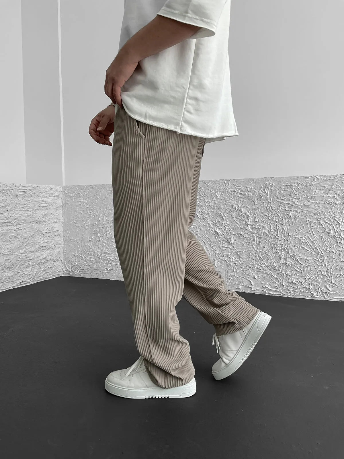 Relaxed fit corduroy trousers for men — side profile view