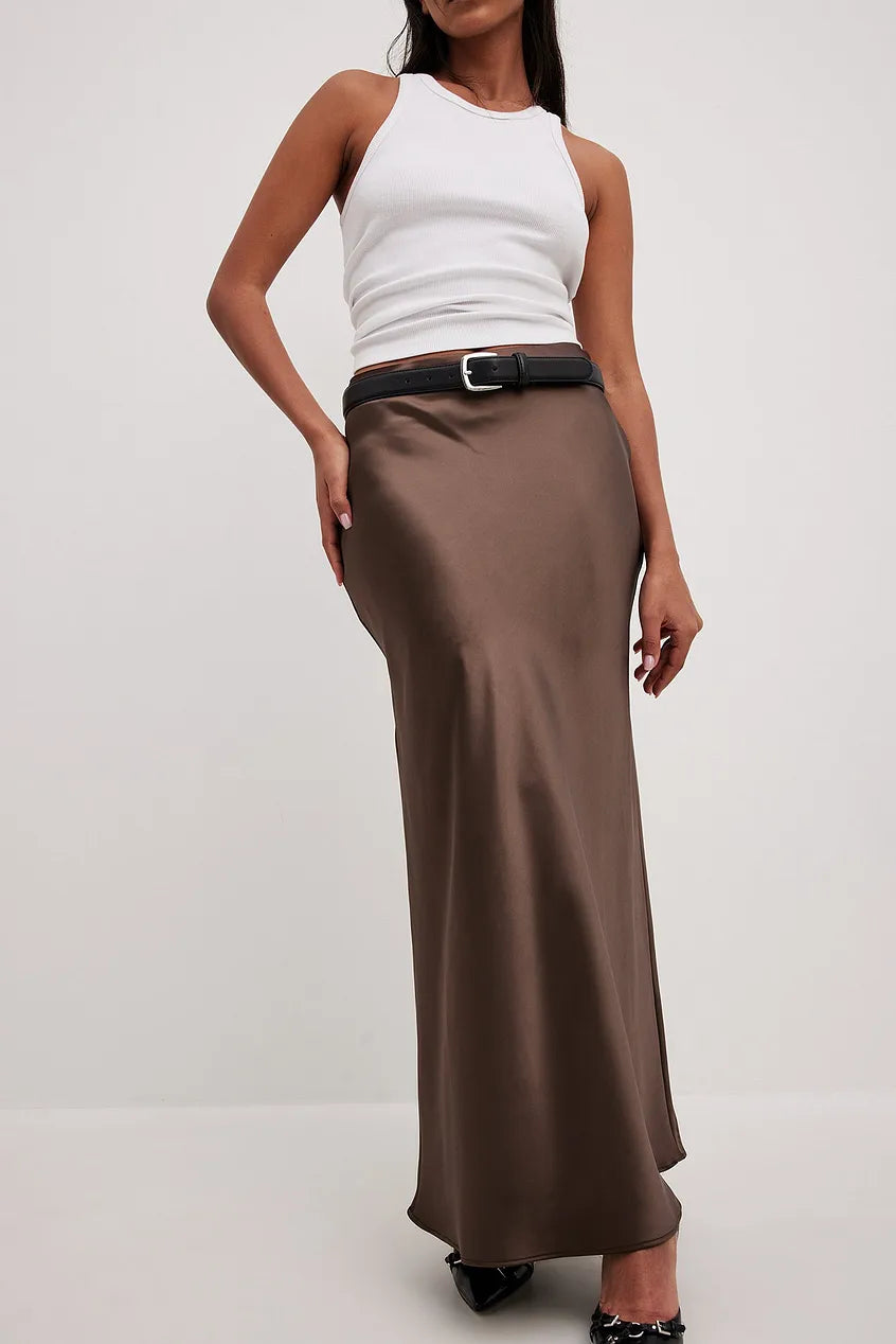 Satin midi skirt for women with smooth finish and midi hemline, standing pose
