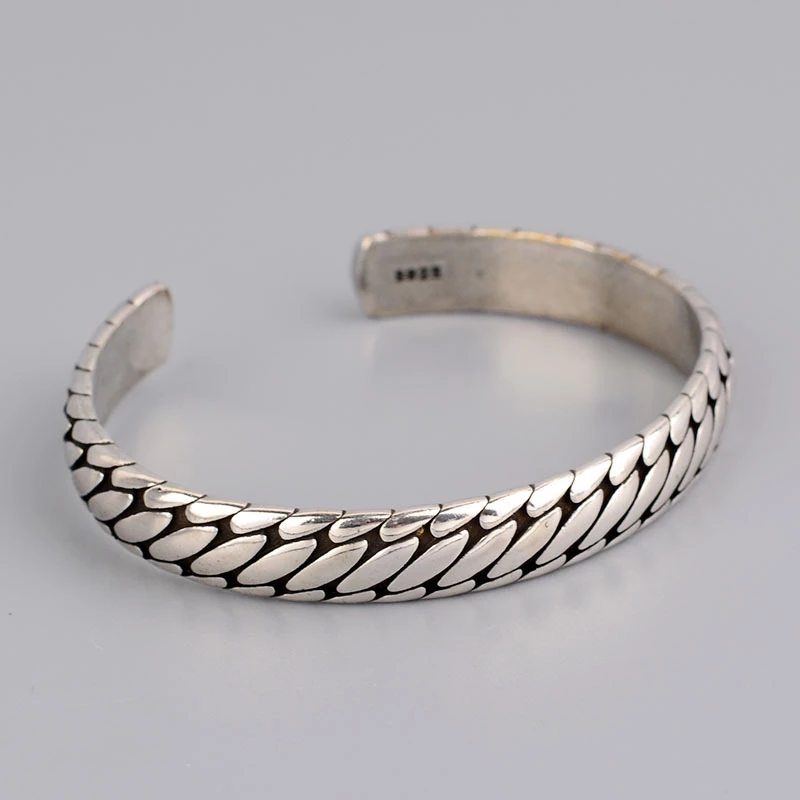 Metal alloy open cuff bracelet displayed flat, suitable for gifting and styling
