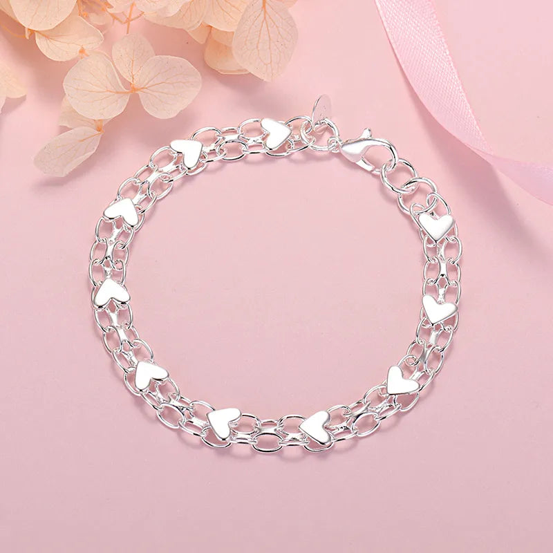 Heart-link metal bracelet with adjustable extension chain for women