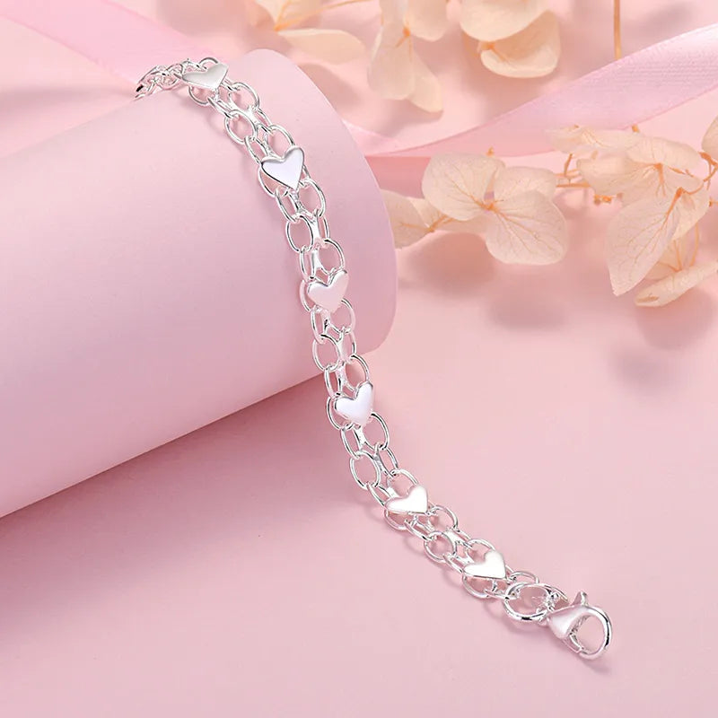 Women's heart-shaped chain bracelet with lobster clasp closure